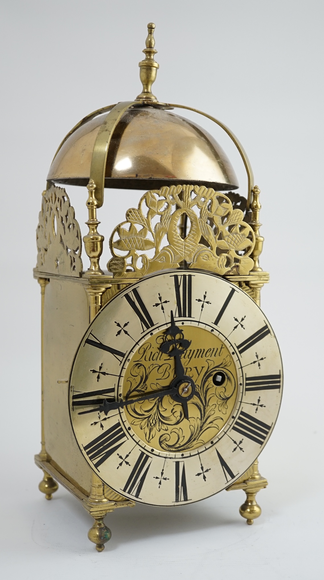 Manner of Richard Rayment of Bury. A Victorian 17th century style lantern clock, in traditional brass case with silvered Roman dial and eight day single fusee movement striking on a bell, 17cm wide, 14.5cm deep, 38cm hig